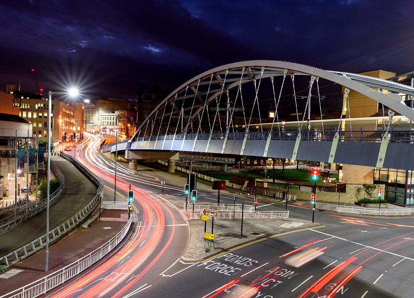 The iconic Sheffield tram bridge illuminated in the night sky